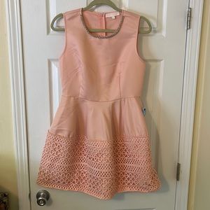 Pink mini dress with jewel neck detail